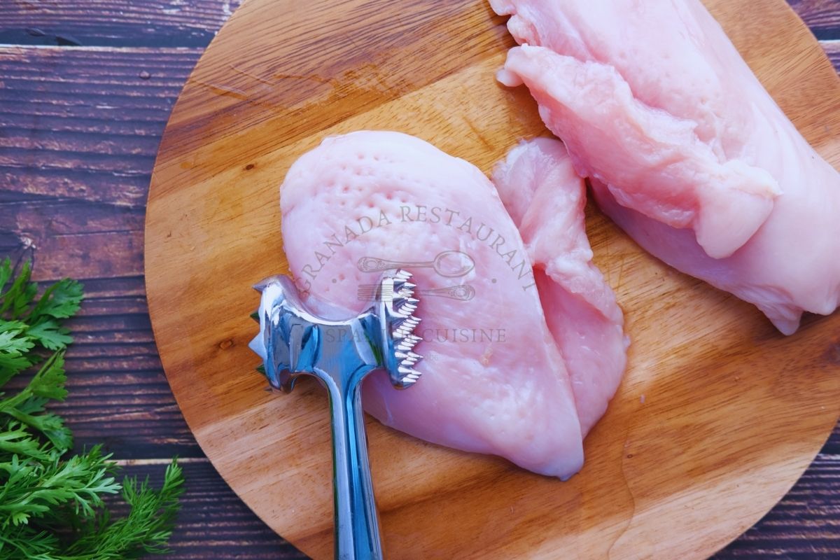 chicken breast on a cutting board